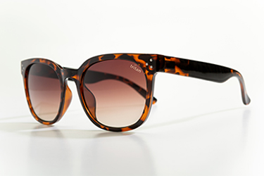 Side view of tortoise shell sunglasses with pink-tinted lenses.