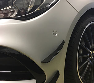A white coating on a front bumper
