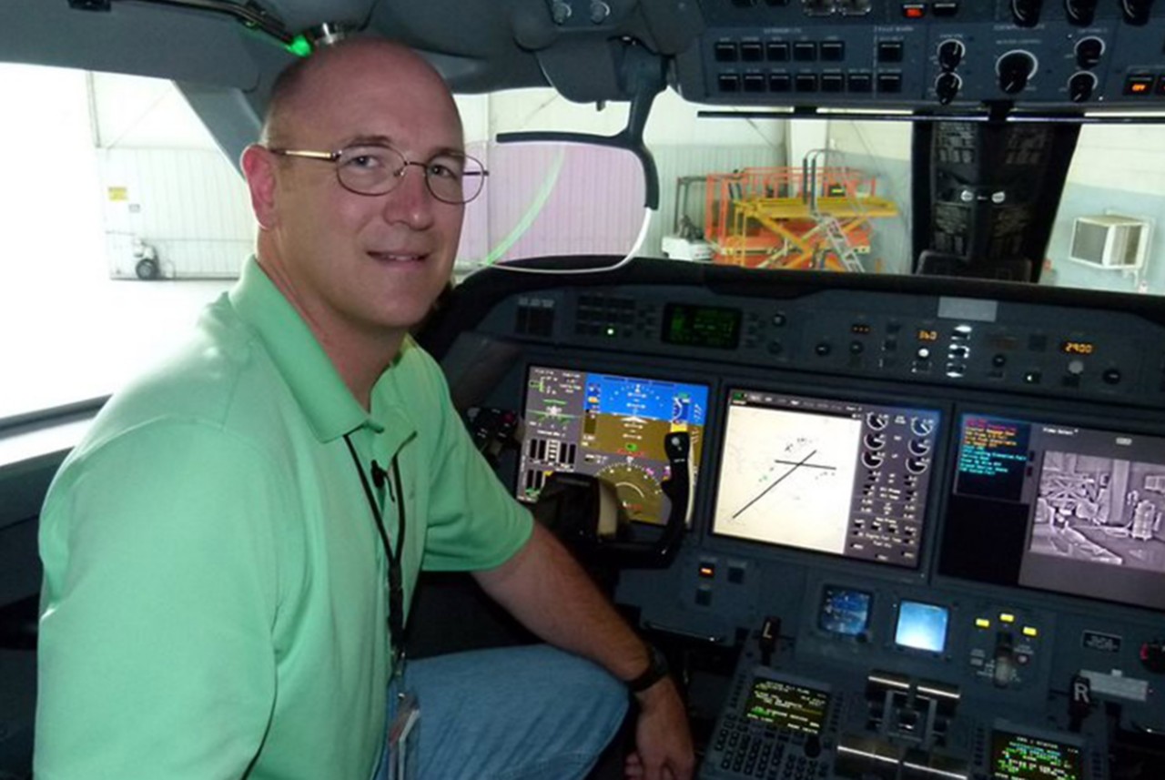 James “Mike” Egan in a plane cockpit 