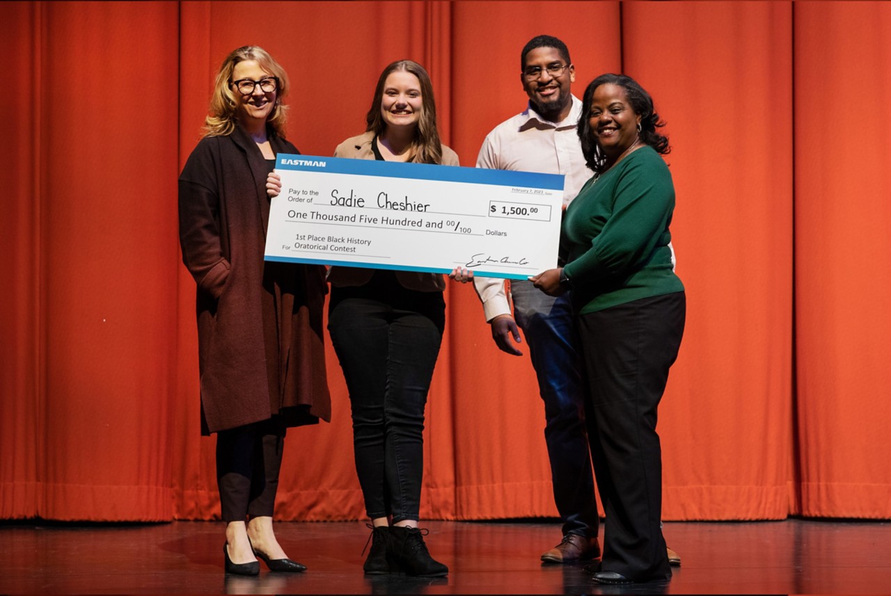 Sadie Cheshier receiving the Eastman Black History Month Oratorical Award 