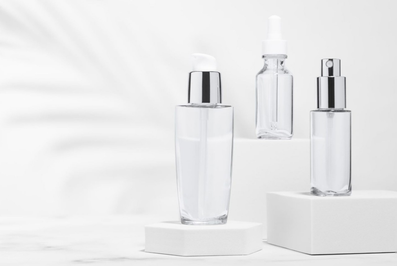  Empty cosmetic product bottles made with Eastman Cristal One E Renew 
