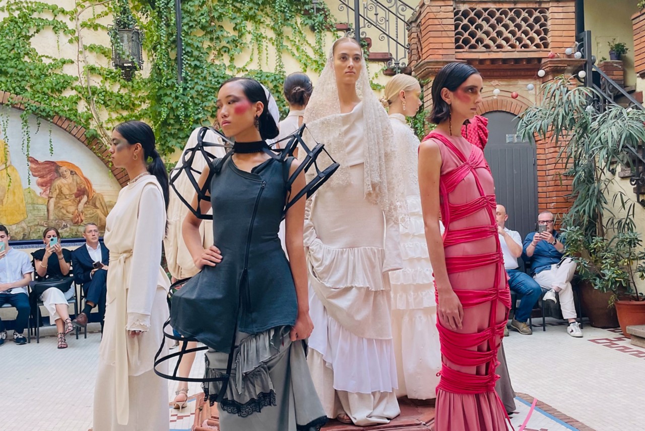 Nine people pose at Bunka Fashion College during the Naia team’s presentation