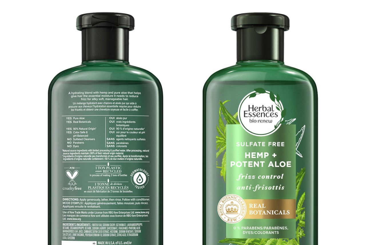 Front and back view of an Herbal Essences shampoo bottle, including recycled content messaging. 