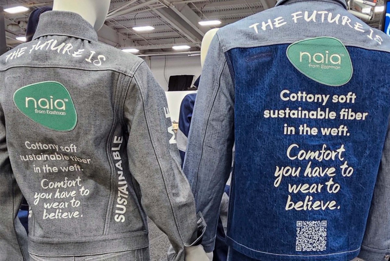 The backs of two denim jackets feature the Naia logo and information about the cottony soft comfort of Naia sustainable fiber.