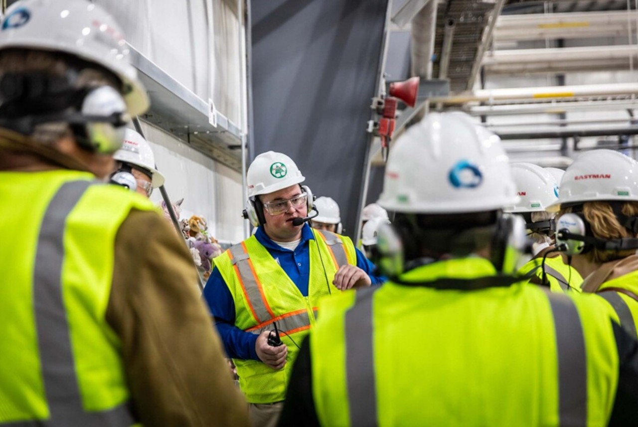 Spencer Tidwell in proper protection equipment, leading a tour of Eastman’s methanolysis plant. Spencer Tidwell in proper protection equipment, leading a tour of Eastman’s methanolysis plant.