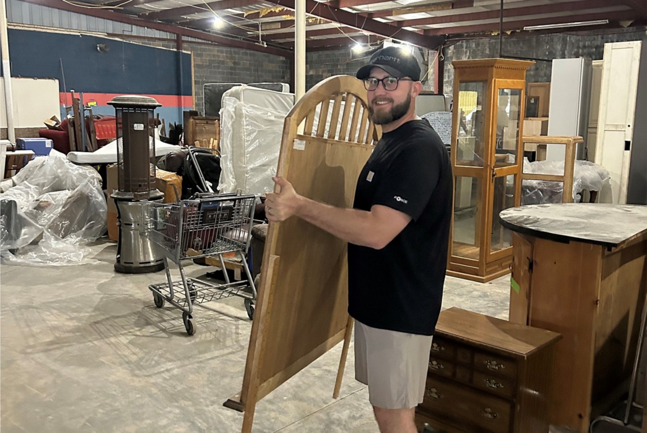 Cody Day holding a mirror. 