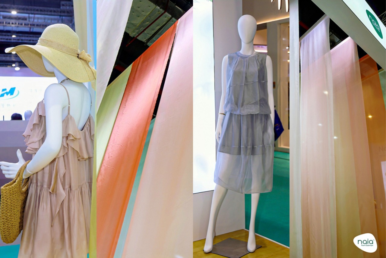A collage of images from the booth, including two mannequins in garments and two fabric installations. 