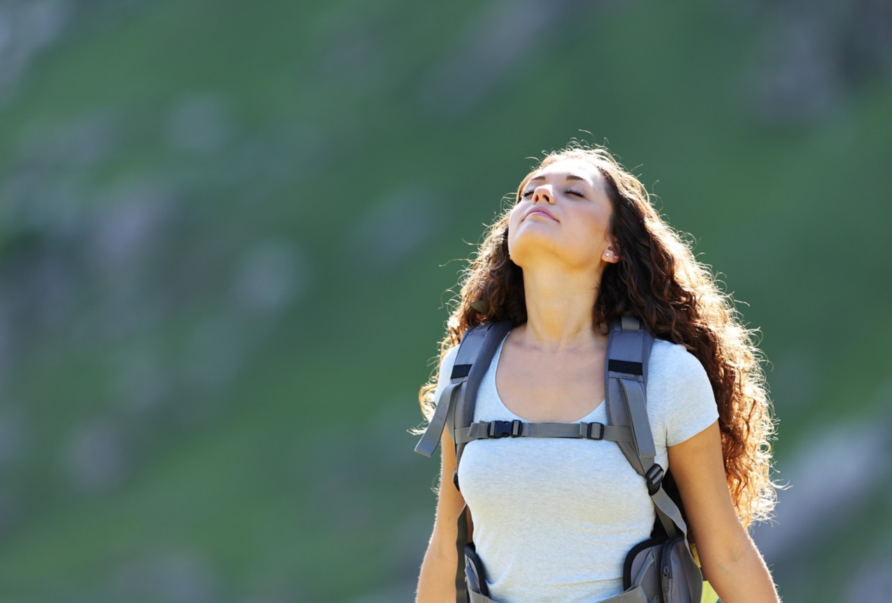 Backpacker in the mountain breathing fresh air. 